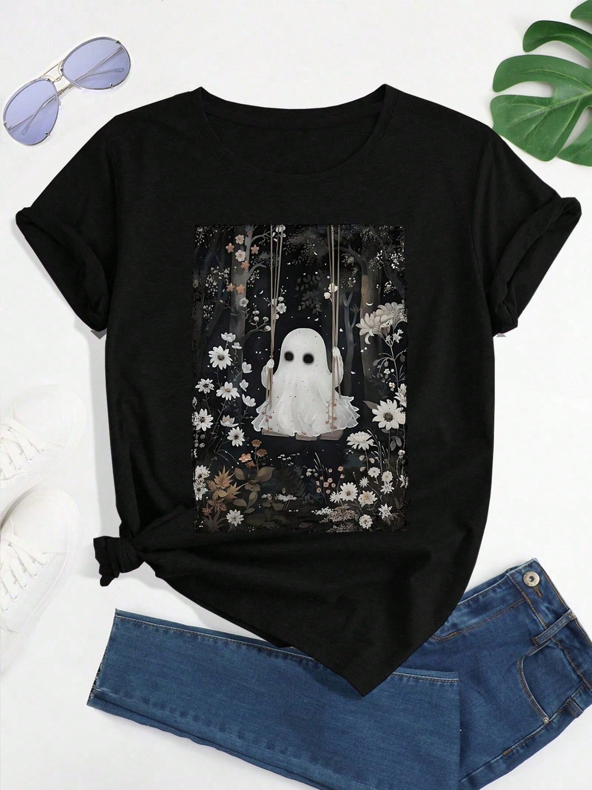 A Ghost Swinging On A Black Background With Flowers, Featuring A Cottagecore Aesthetic For Halloween, Printed On A Short-Sleeve Crew Neck Casual T-Shirt
